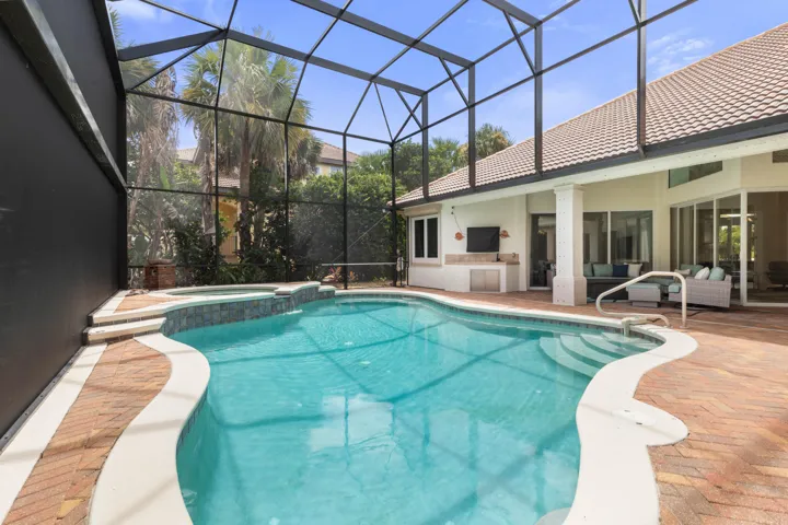 From refreshing morning swims to a late-night soak in the spa, this screened pool setting turns the backyard into a destination all its own.