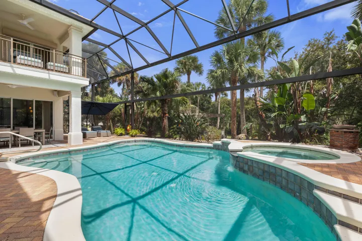 A private resort experience awaits in your own backyard, where the sparkling pool and spa are wrapped in lush seclusion—made for long afternoons in the water and evenings under the stars.