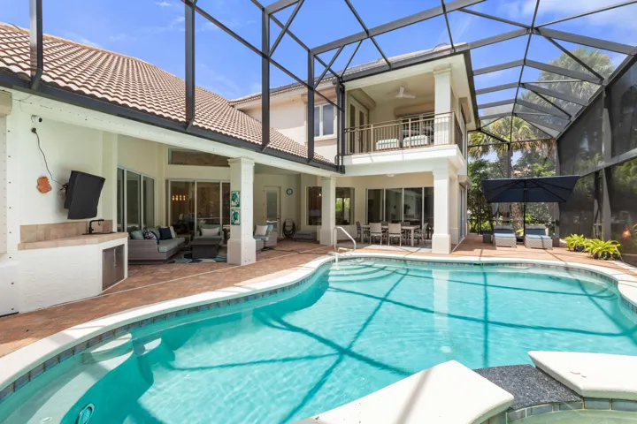This is where Florida days are meant to unfold—sunlit swims, shaded lounging and leisurely dinners, all within a private screened pool setting made for enjoying life at home