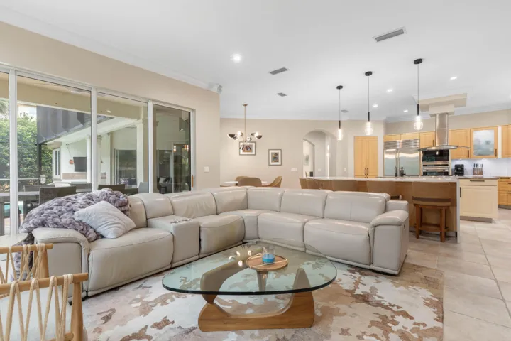 This is where the home comes alive—an expansive setting where the kitchen, casual dining and family room come together beautifully for everything from quiet nights in to a house full of guests.