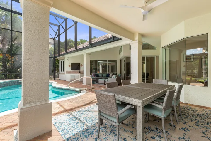 Made for long lunches that turn into lazy afternoons—this covered poolside dining space keeps every gathering close to the water.
