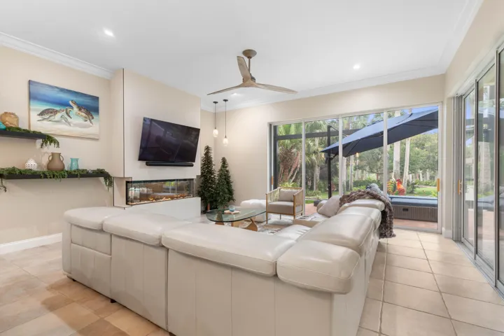Made for unwinding, the family room pairs fireside comfort with wide-open views to the outdoor living beyond—one of those spaces that makes staying home feel like a luxury