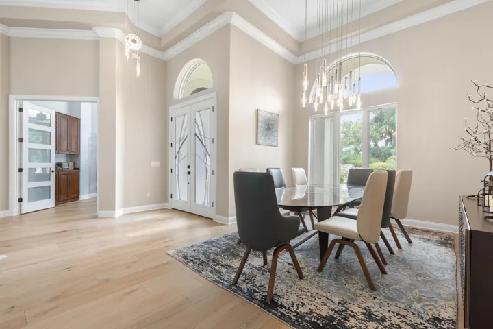 Dinner deserves a little drama—volume ceilings and sculptural lighting give this dining room an impressive presence, ready for everything from intimate dinners to holiday celebrations.
