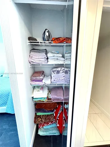 Third closet in bedroom, could be used for linens