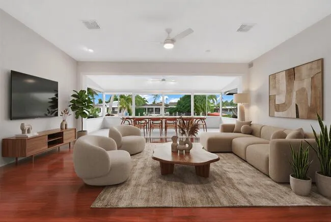 Virtually staged. Wood-finish flooring, recessed lighting, and a ceiling fan