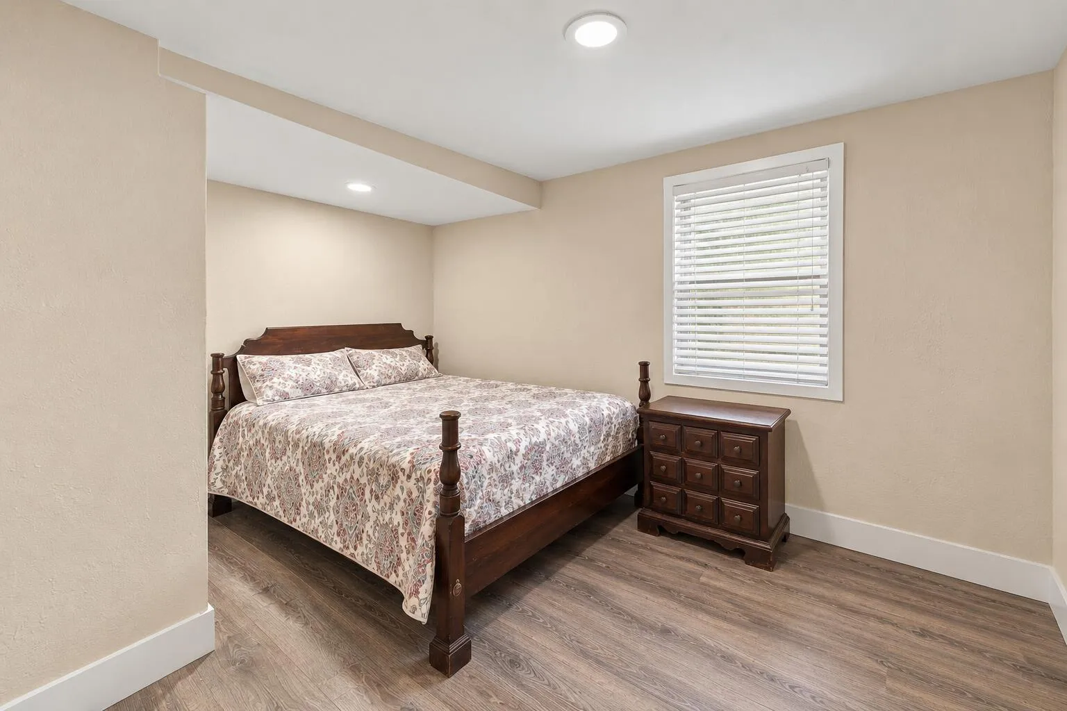 Tidy Traditional Bedroom with Floral Bed