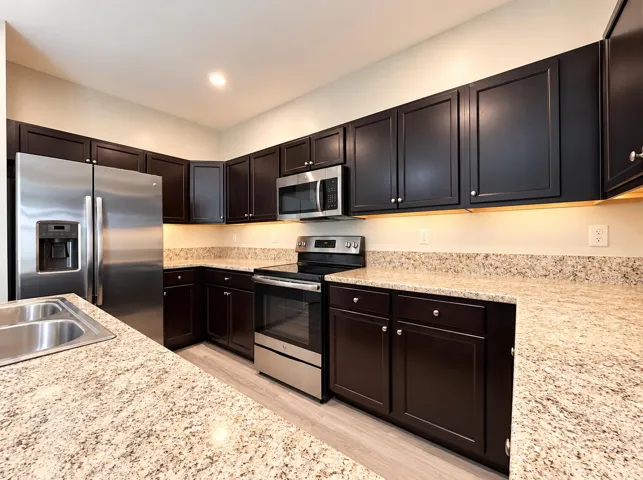 Modern Espresso Kitchen with Granite Cou