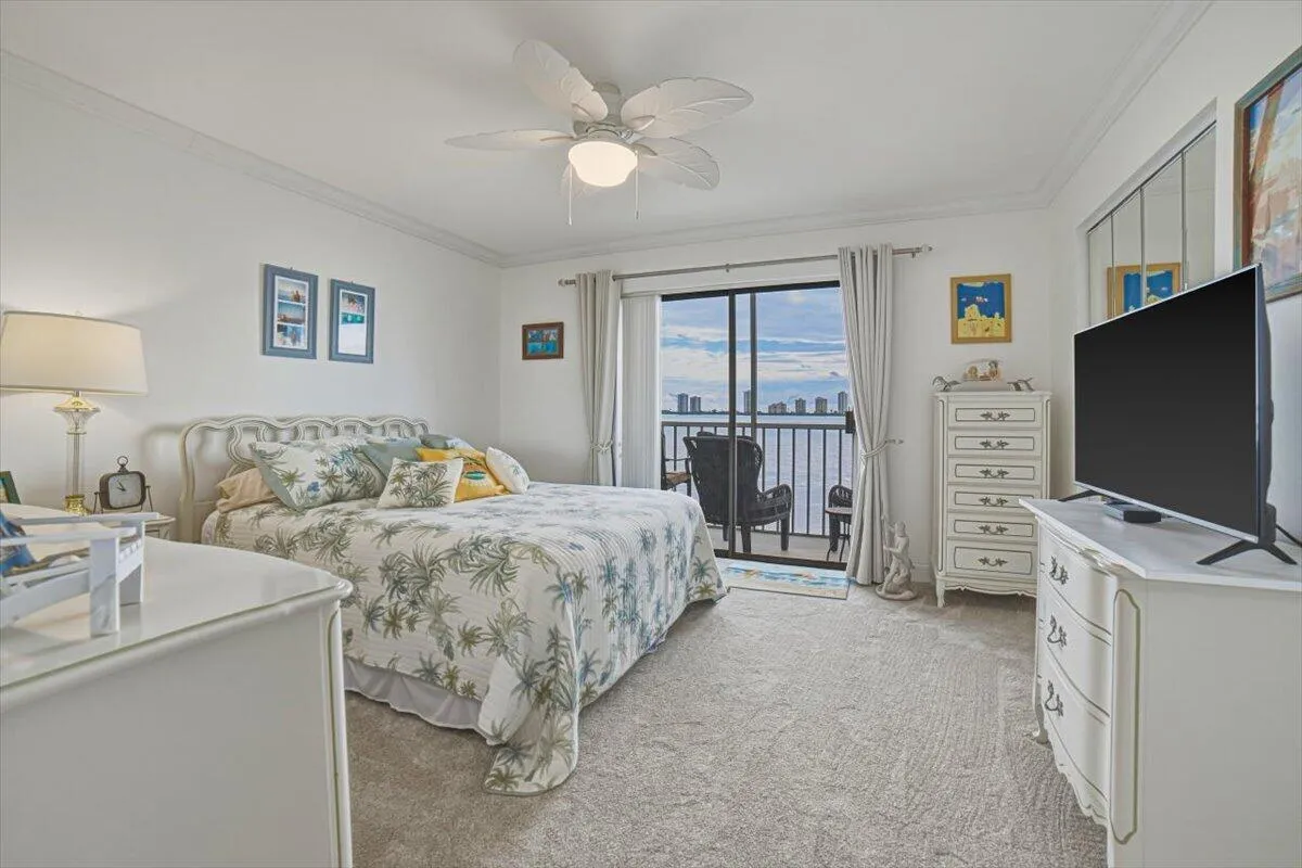 Bedroom with sliders out to balcony