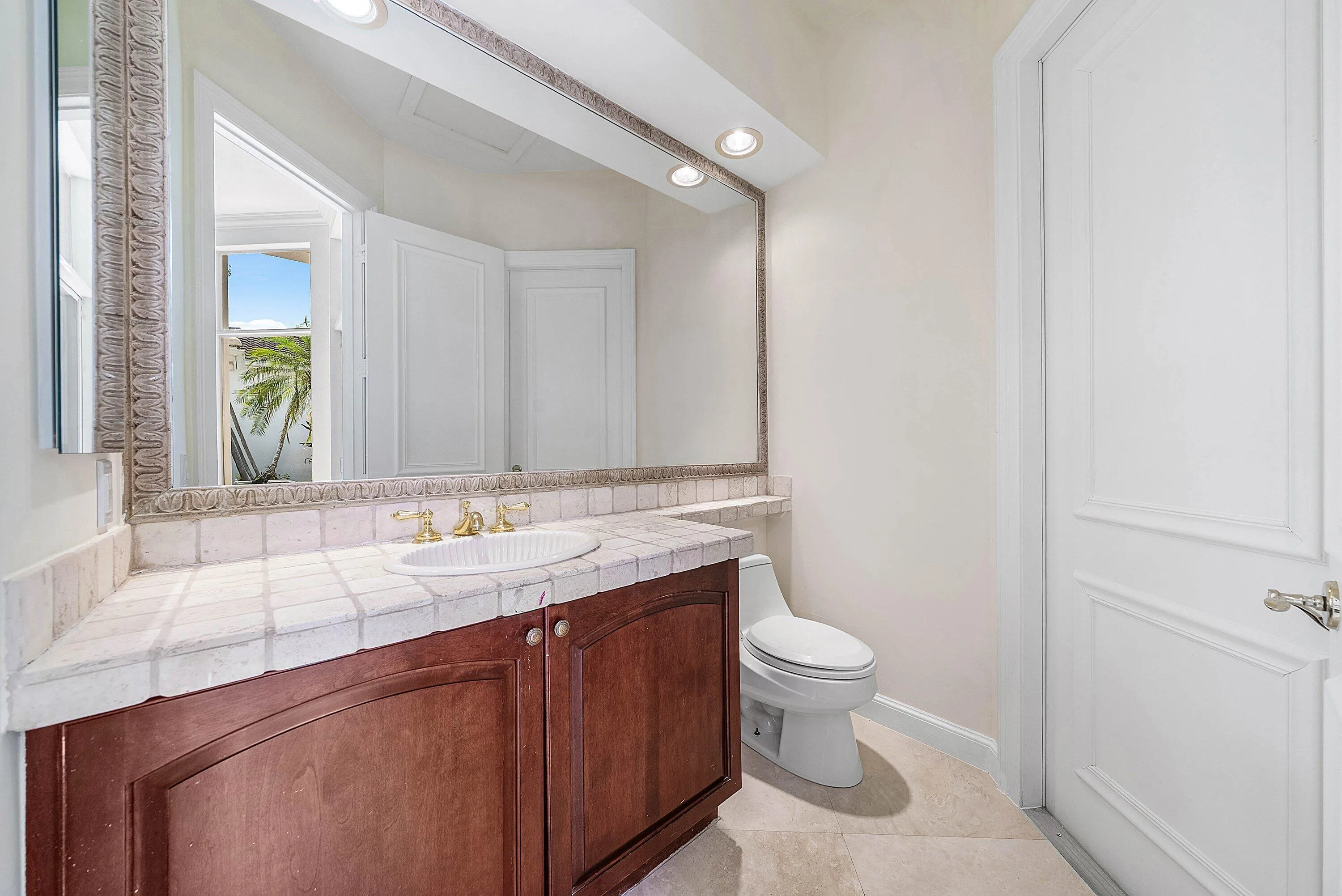 Powder Room with access to pool area off of family room