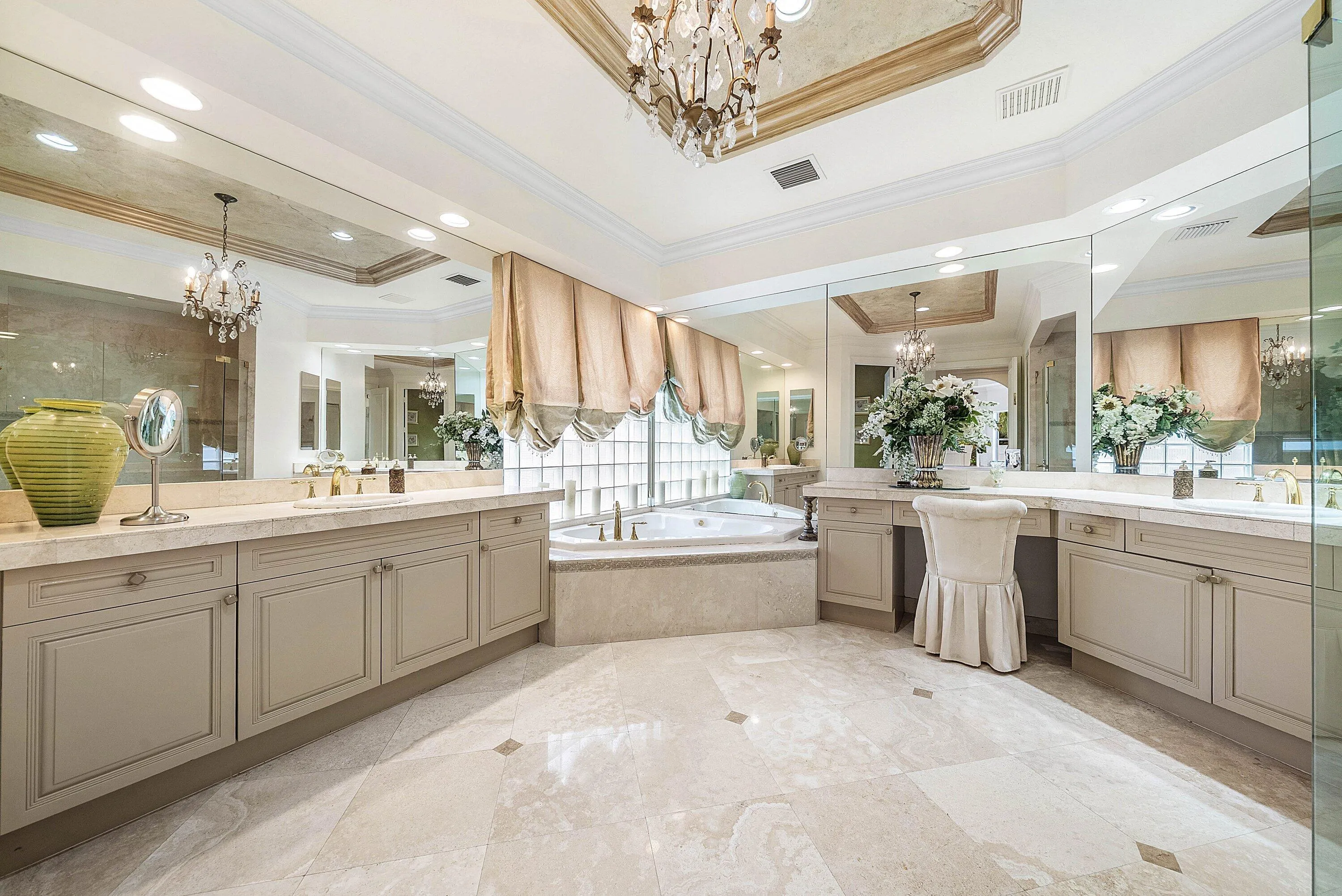 Extensive vanity with dual sinks, built-in makeup area, and integrated storage