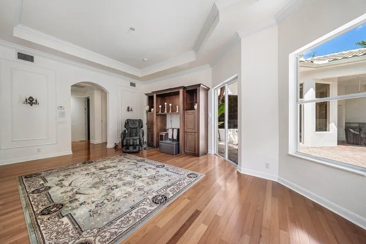 Engineered Hardwood flooring, crown molding, tray ceiling - slider access out to pool area