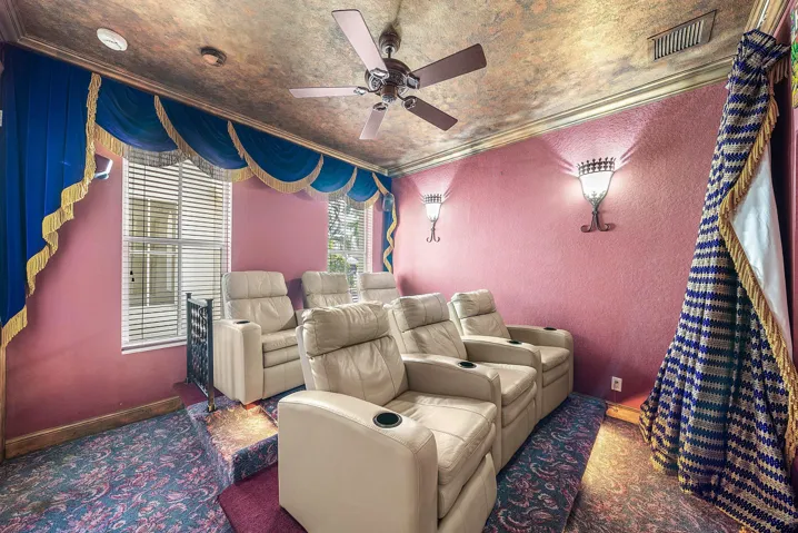 Tiered seating with wall sconces, ceiling fan