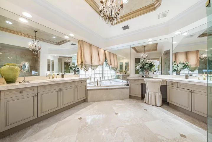 Extensive vanity with dual sinks, built-in makeup area, and integrated storage