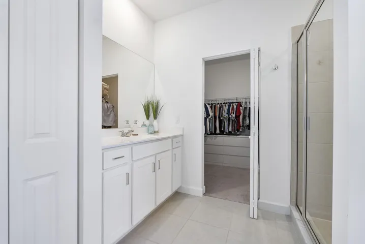 Primary Bathroom with His/Hers Walk-in Closet