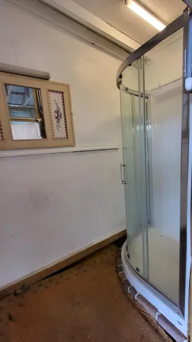outdoor shower accessed in boat house
