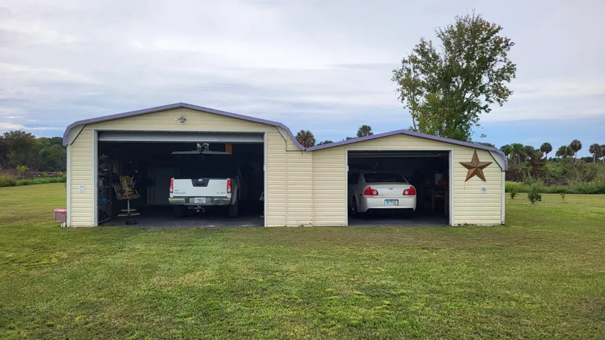 Adjoined 2-car garage/asphalt floors