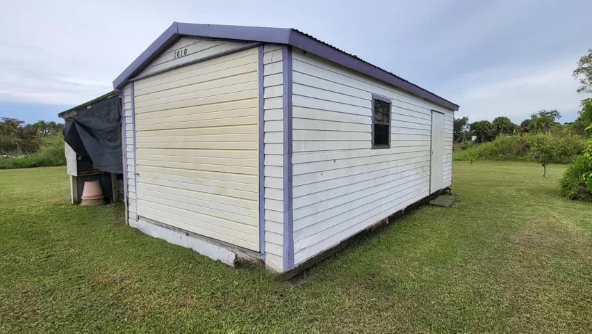 3rd outbuilding/aluminum shed with side potting shed