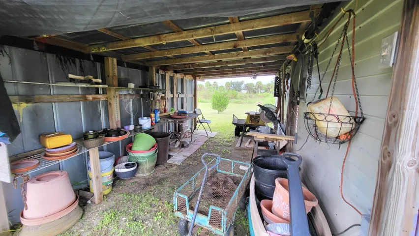 3rd outbuilding/potting shed left side; dirt floor