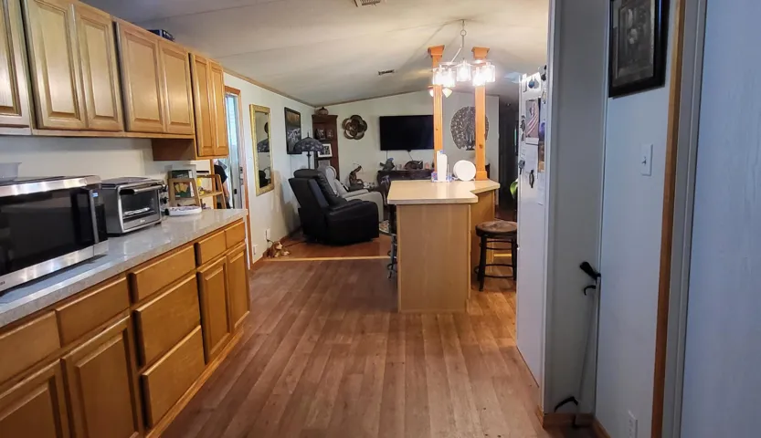 View from Laundry closet toward kitchen & Living Room