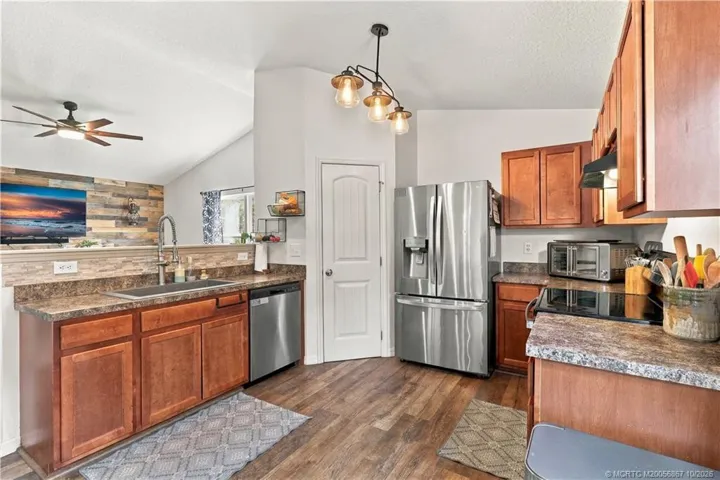 Kitchen with wood cabinetry and stainless appliances