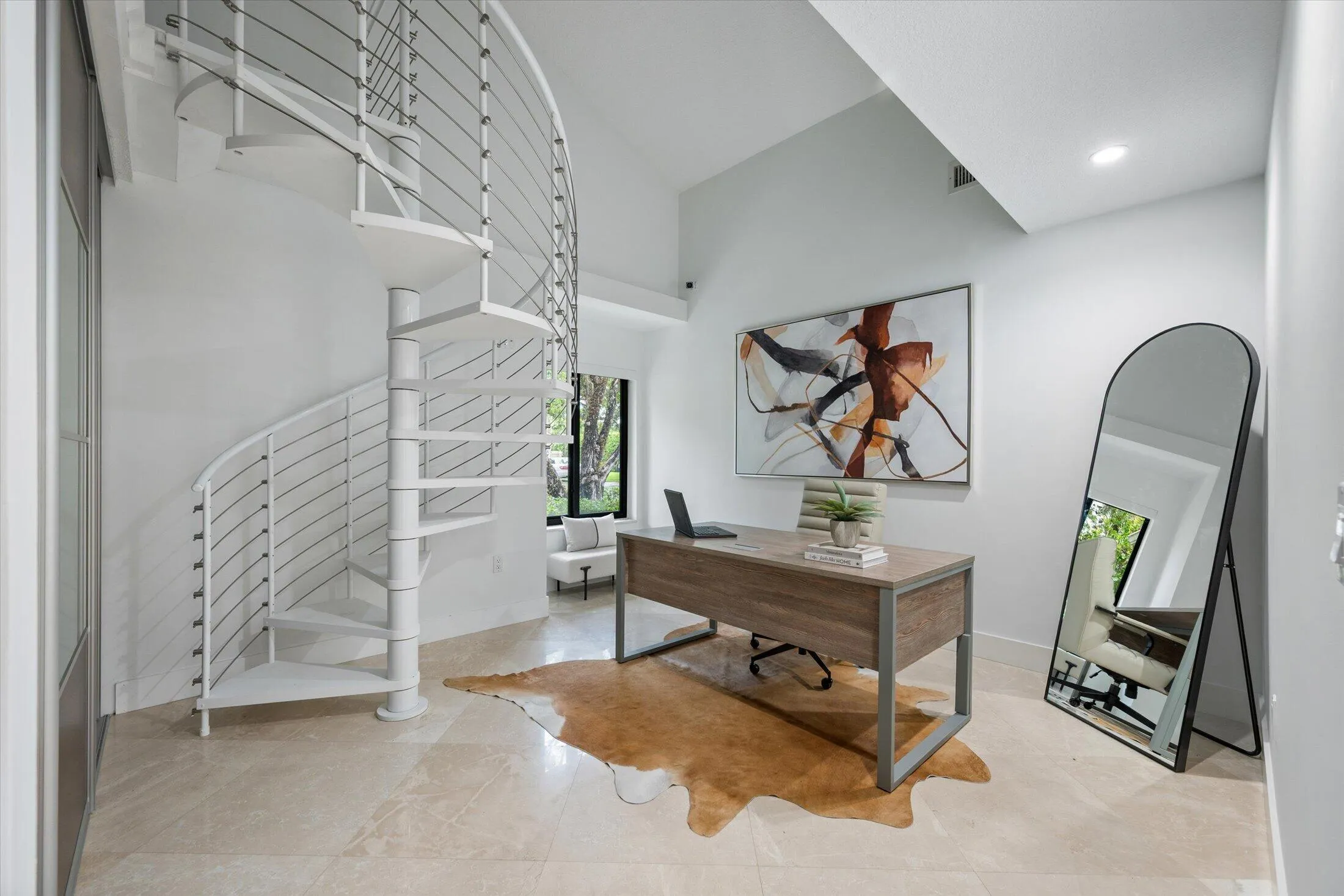 Spiral staircase with cable railing, high ceilings, recessed lighting, and light-toned tile flooring