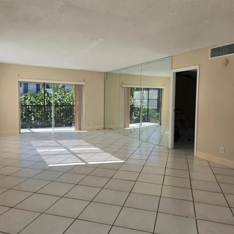 Tile flooring with freshly painted neutral wall color.