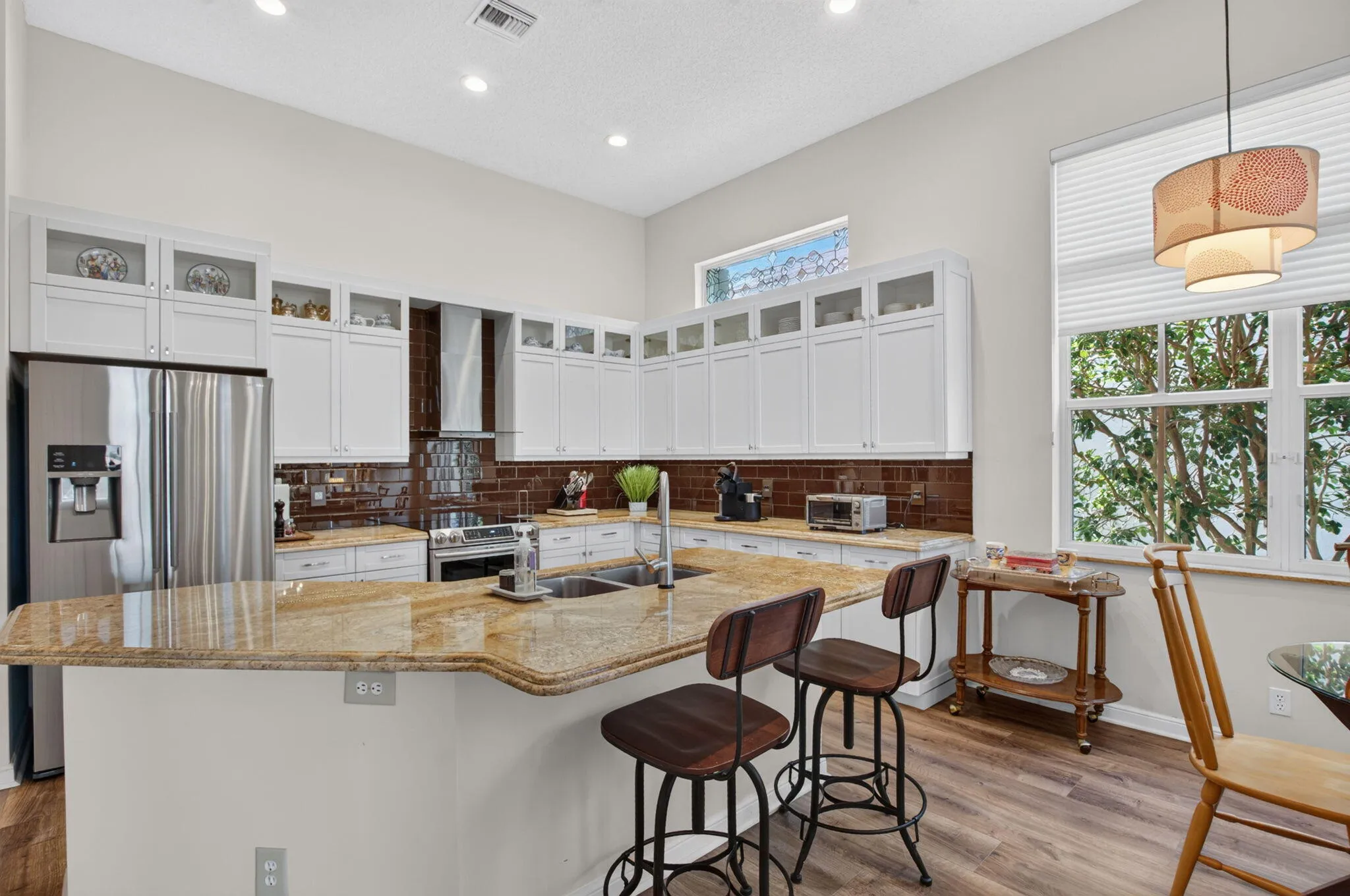 white wood kitchen with granite stone countertops
