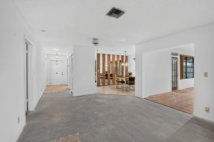 LIVING RM INTO FAMILY ROOM AND DINING