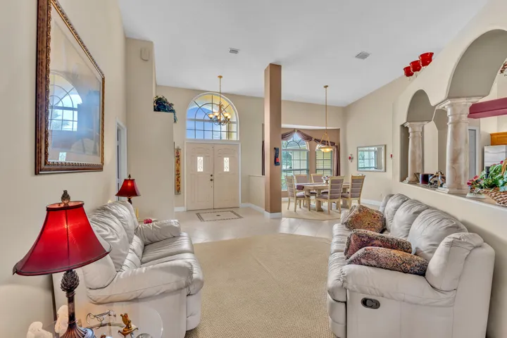 Grand entry with double doors and arched transom window