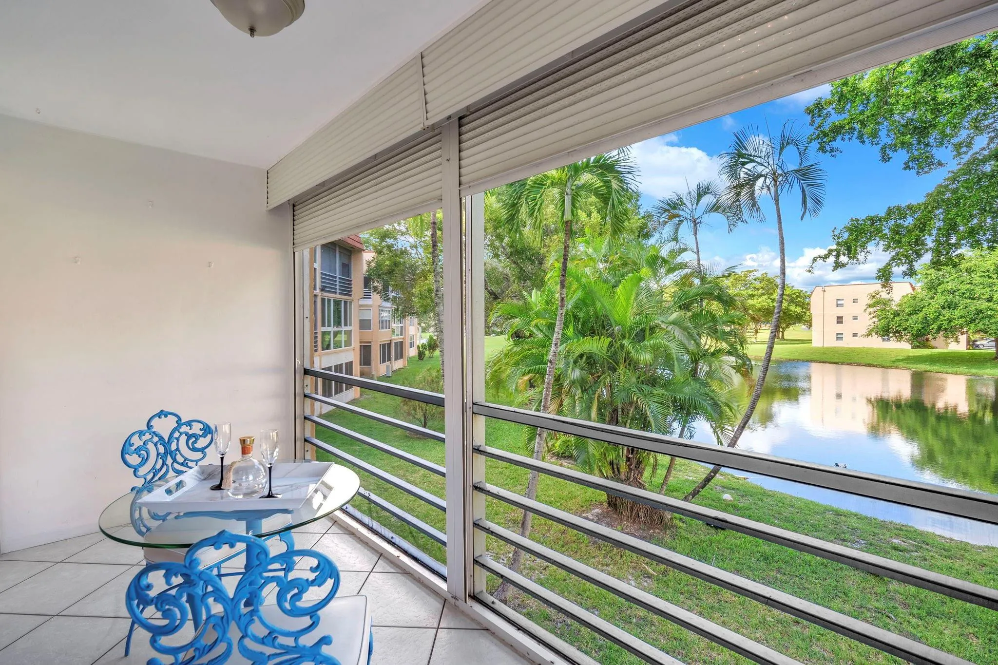 Screened patio, lake views at 9301 Sunrise Lakes Blvd 207
