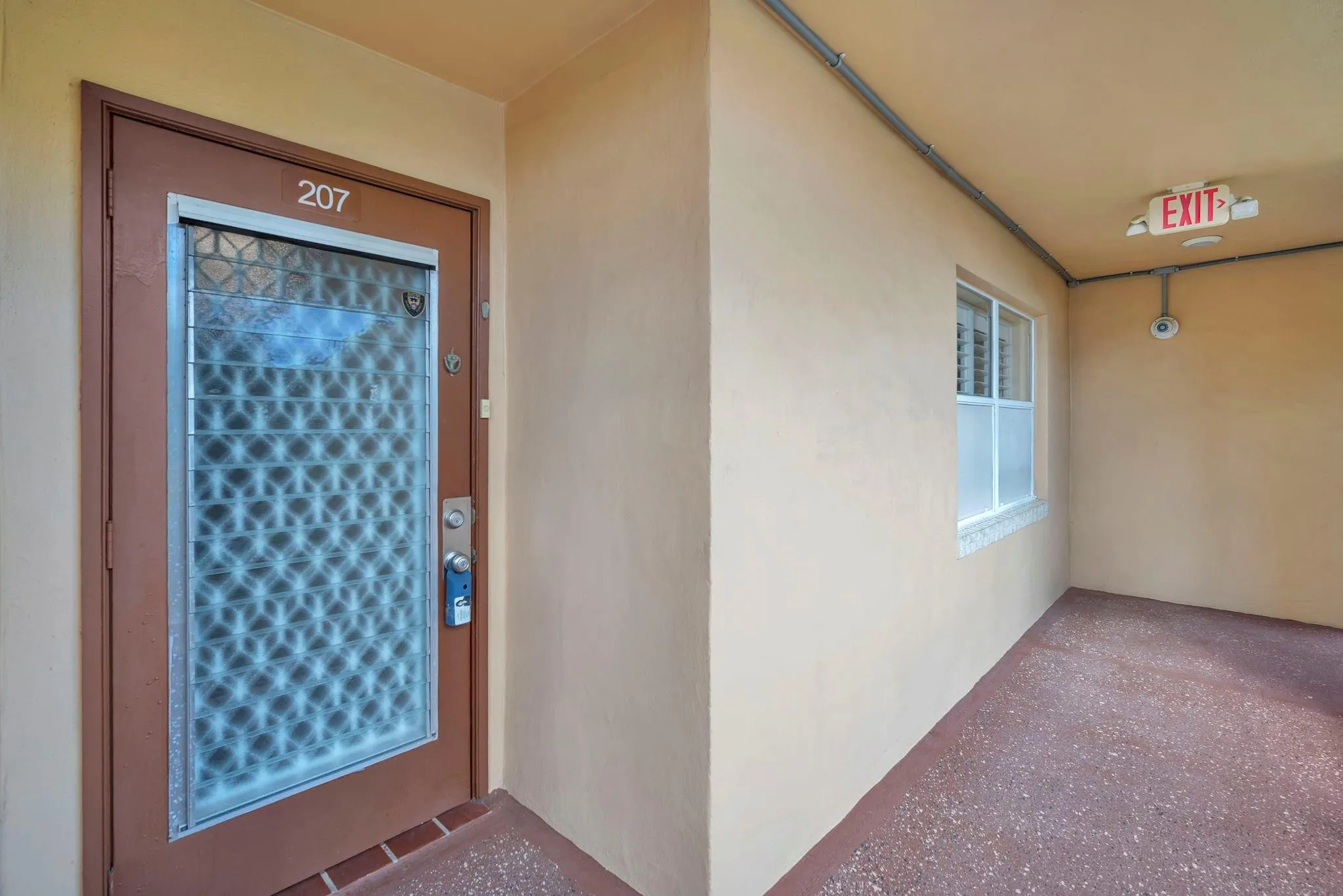 Front door of the unit 207, 9301 sunrise lakes blvd