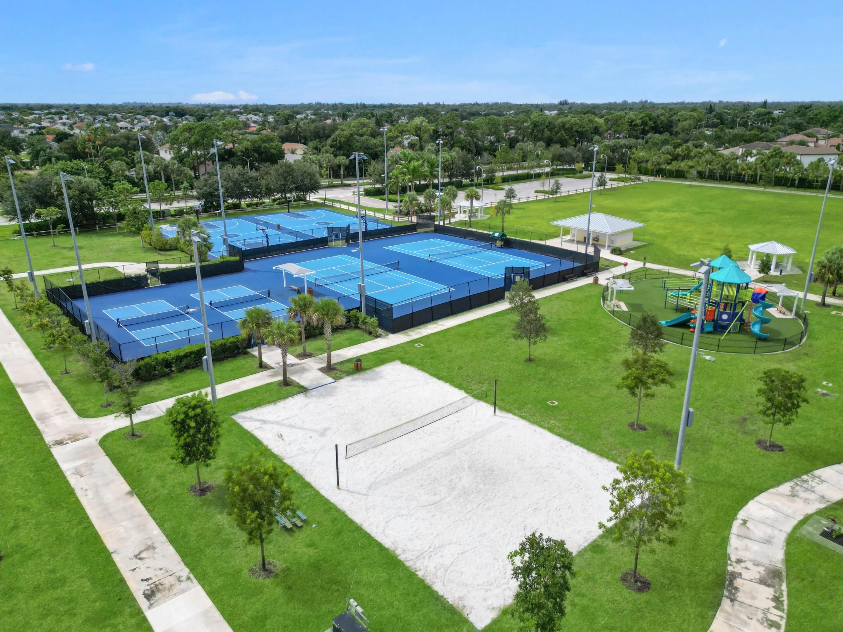 Crestwood Park. Multiple tennis courts, dedicated sand volleyball court, children's playground, open green spaces, and a covered pavilion