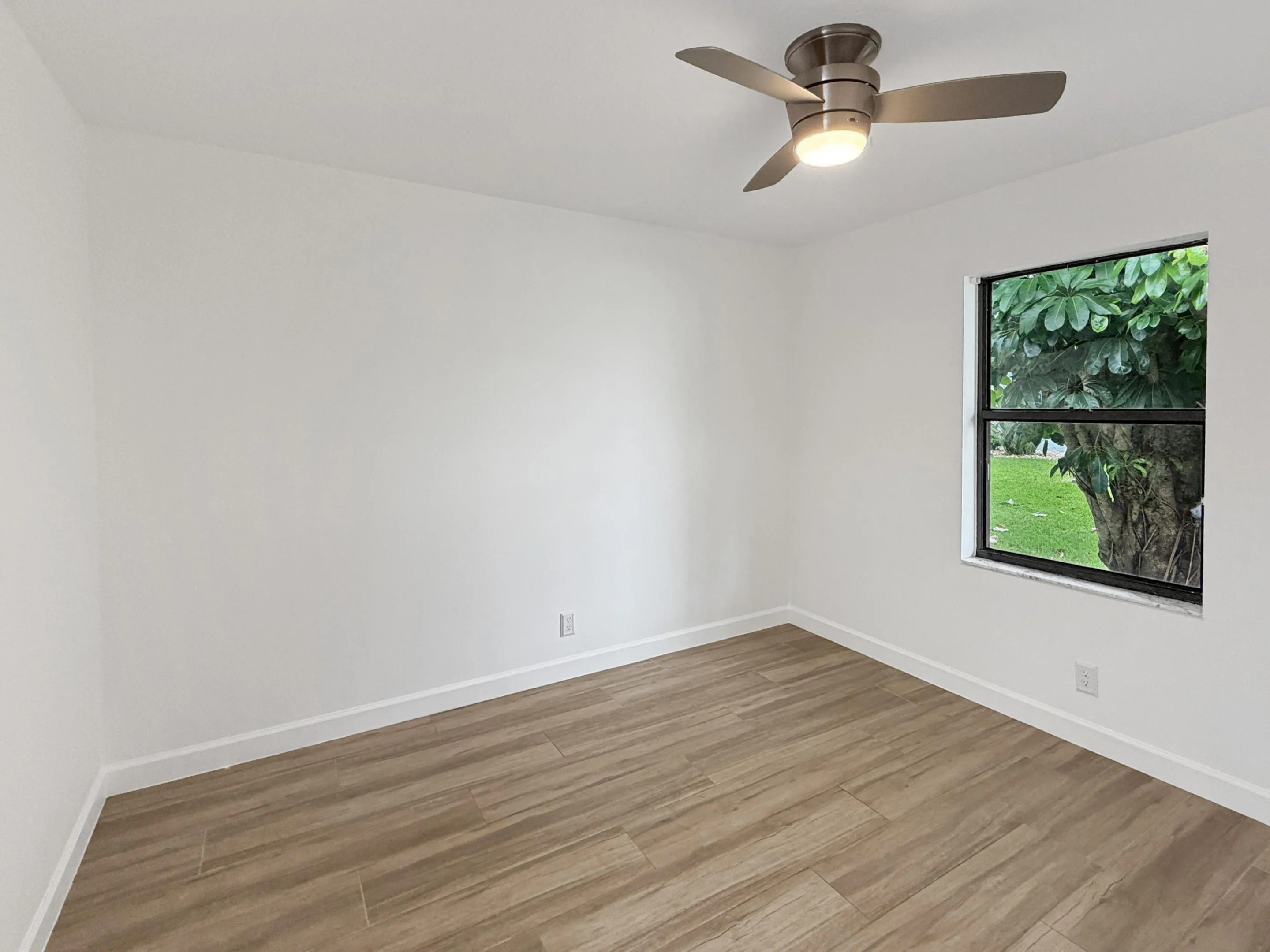 Clean white walls and wood-finish flooring
