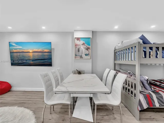 Recessed lighting and wood-finish flooring