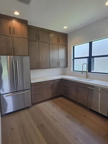 Prep Kitchen with Jenn-Air refrigerator and dishwasher