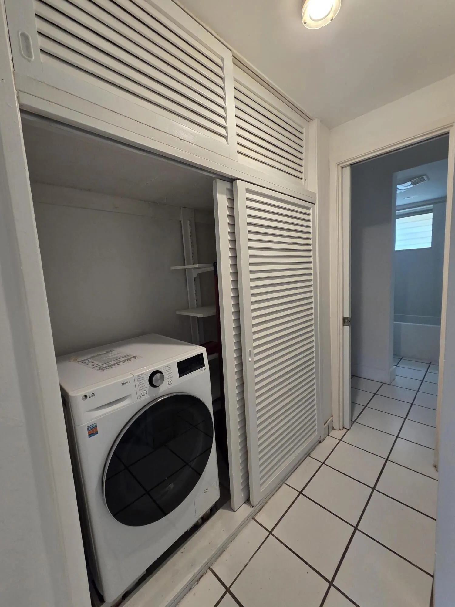 Hallway closet with all in one washer/dryer