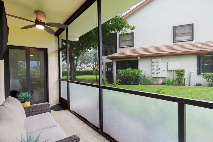 Screened patio with "Florida Fiberglass Screen on the lower half to keep out debris and water while adding privacy