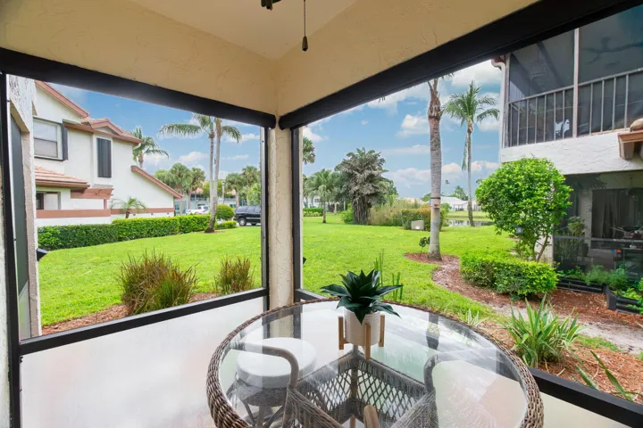 Screened patio with "Florida Fiberglass Screen on the lower half to keep out debris and water while adding privacy