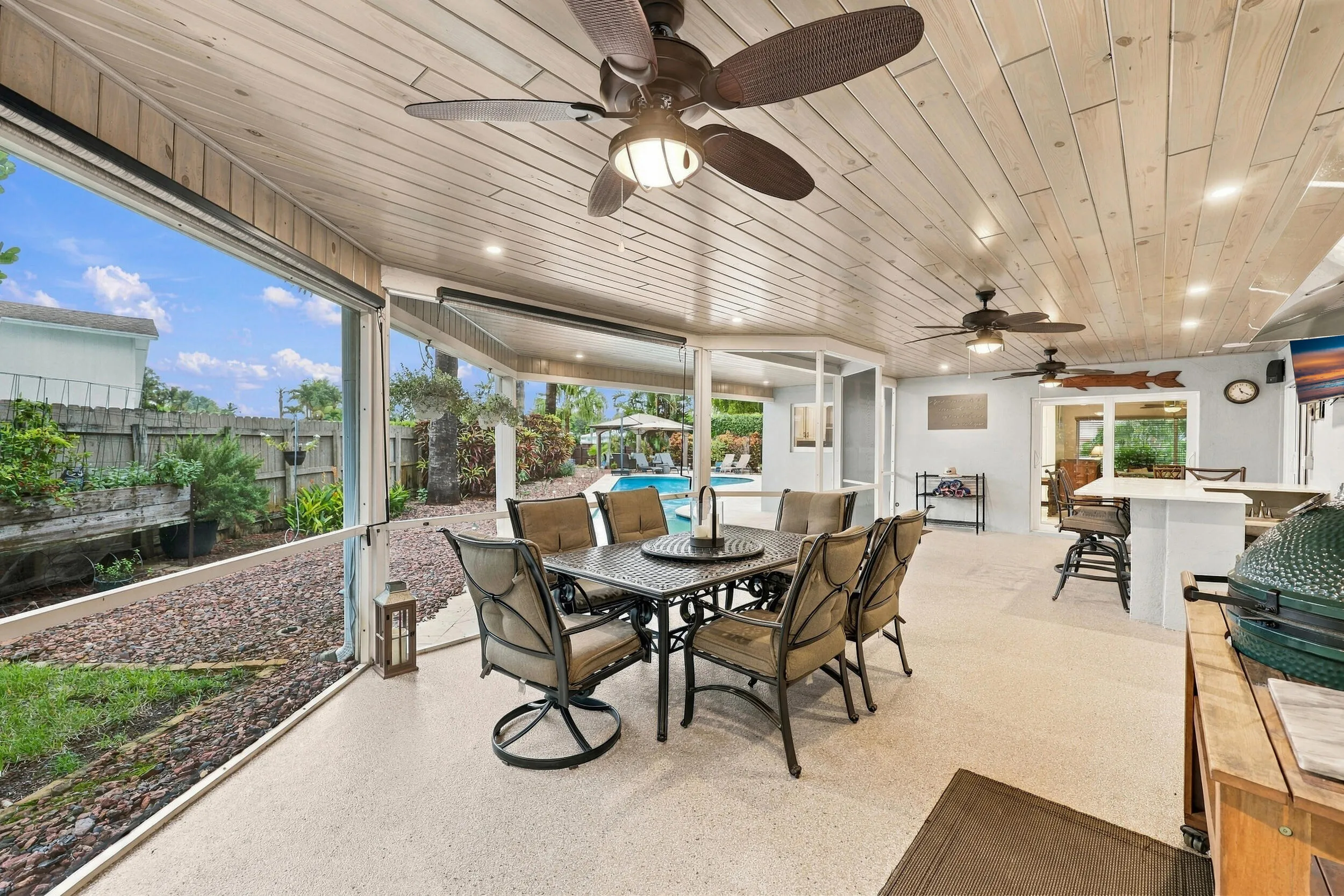 Live the epitome of the South Florida lifestyle with this 900 sq. ft. patio. It offers a built-in bar with quartz countertops, a built-in grill area with hooded exhaust, wood ceilings, recessed lights, tons of privacy and views of Lakeview Golf Course.