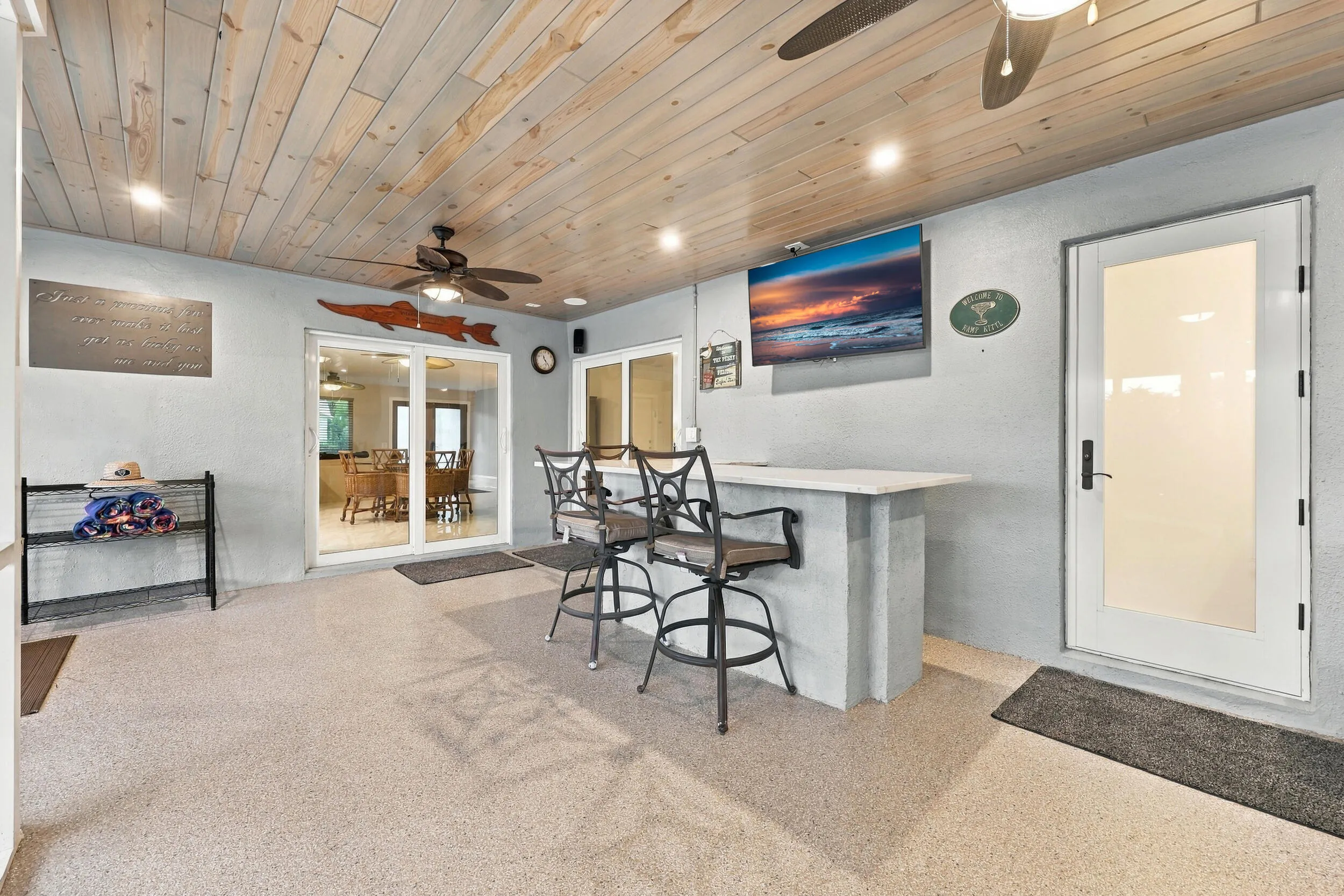Live the epitome of the South Florida lifestyle with this 900 sq. ft. patio. It offers a built-in bar with quartz countertops, a built-in grill area with hooded exhaust, wood ceilings, recessed lights, tons of privacy and views of Lakeview Golf Course.