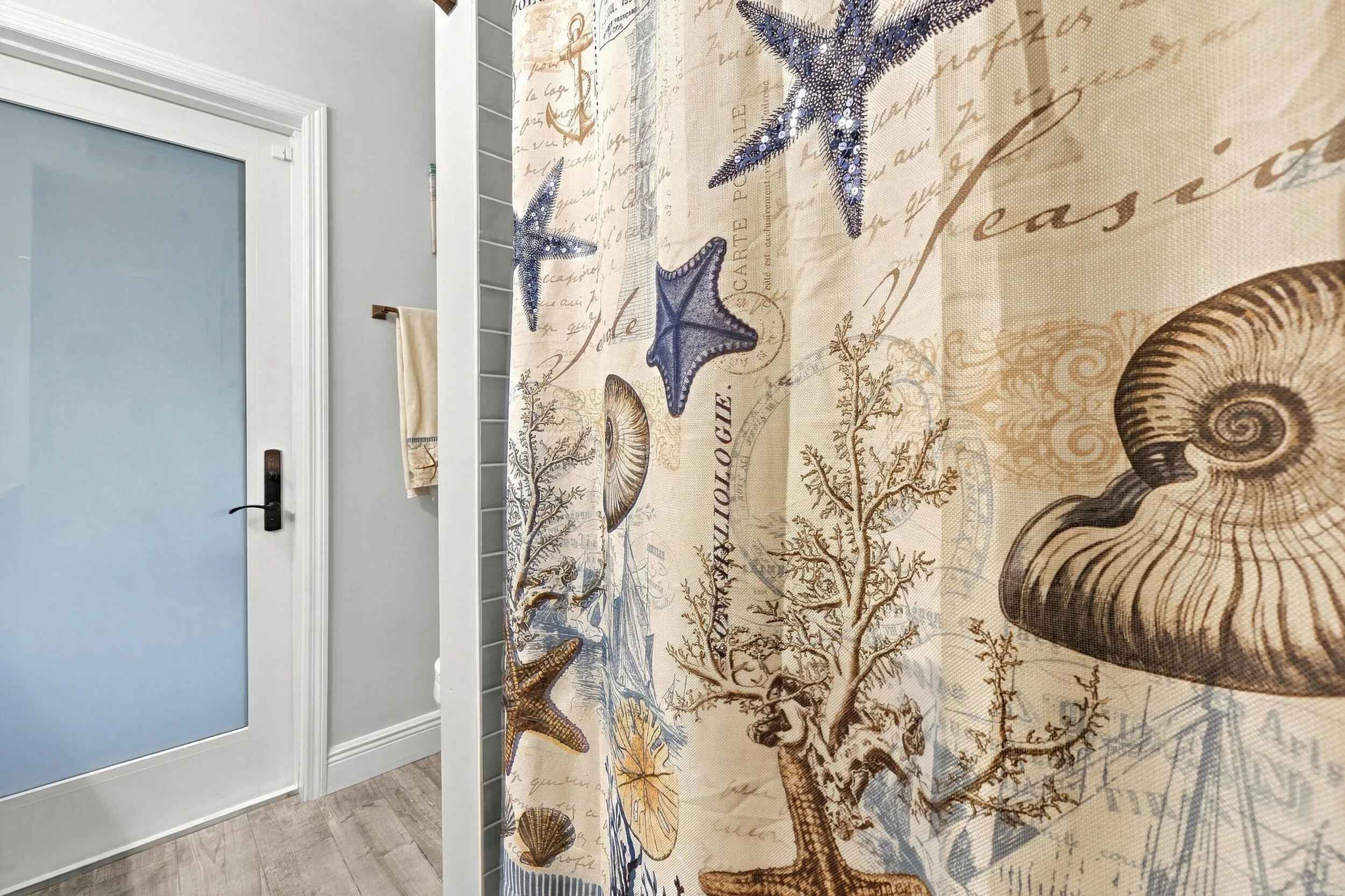 Bathroom 3 is a fully updated cabana bathroom with a new vanity, countertops, tile, and a tub and shower. Your guests will access it while spending days and evenings in the most beautiful backyard in Delray Beach.