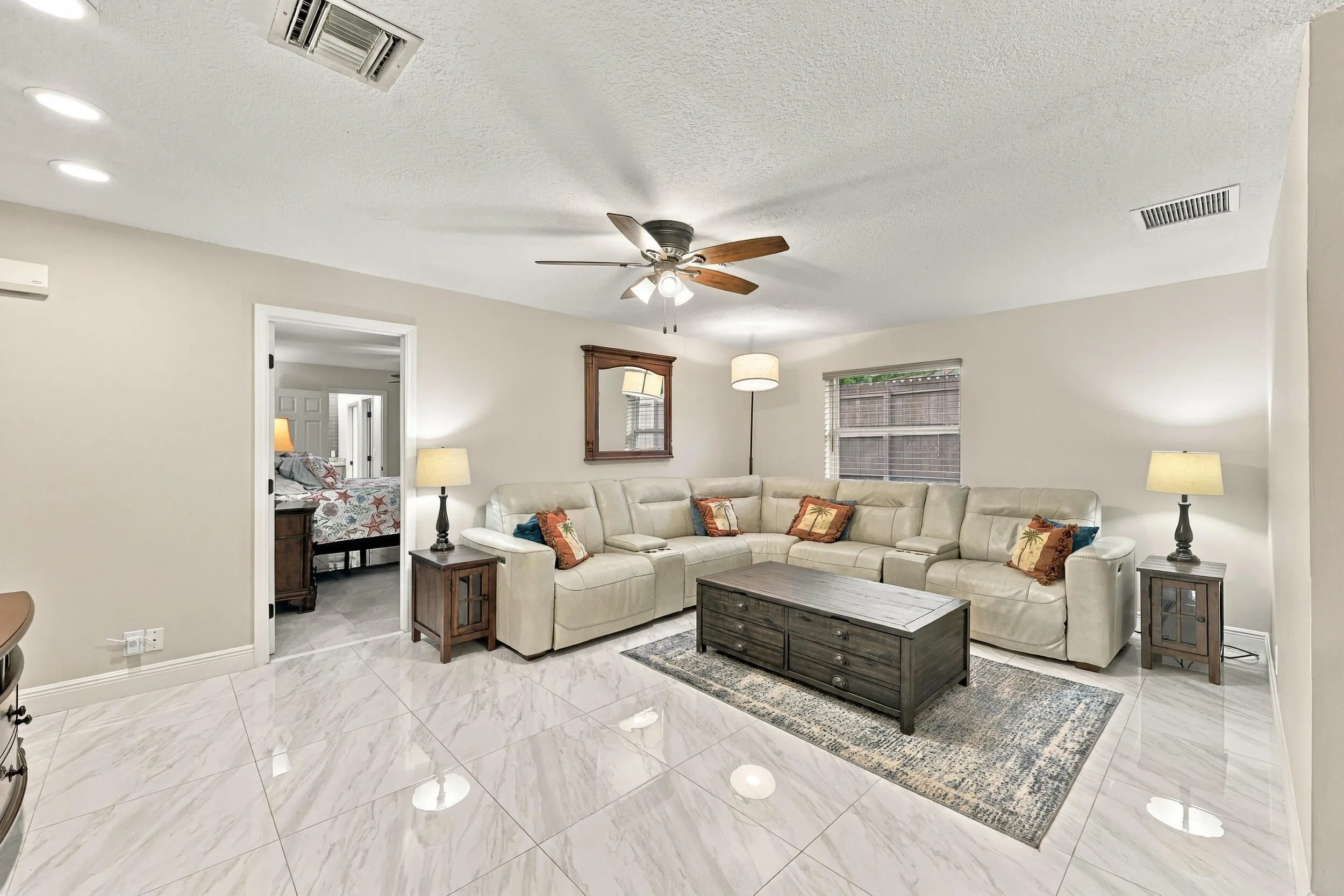 The family room is a versatile space for children of all ages. Relax and enjoy a separate area away from the kitchen and formal living room that also provides direct access through sliding glass doors to the covered patio and one-of-a-kind backyard.