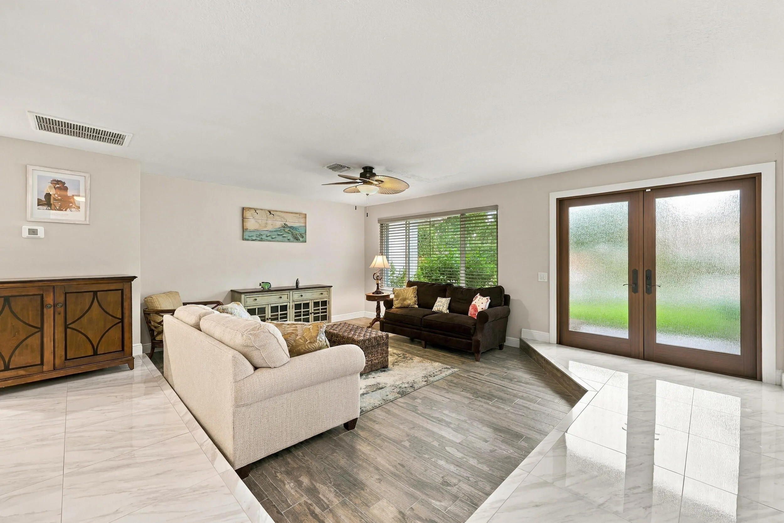 A spacious and versatile floor plan offers a formal living area that flows nicely into the updated kitchen and then into a family or bonus room. Everything revolves around the pool, the resort-style pool, and the 900-square-foot covered, screened-in patio.