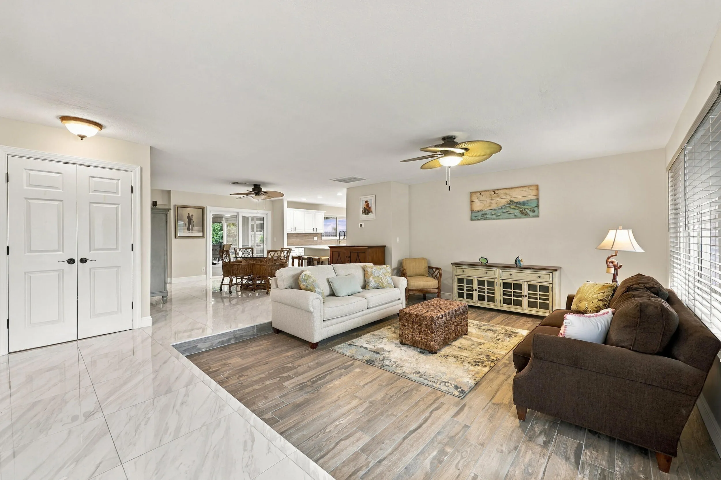 A spacious and versatile floor plan offers a formal living area that flows nicely into the updated kitchen and then into a family or bonus room. Everything revolves around the pool, the resort-style pool, and the 900-square-foot covered, screened-in patio.