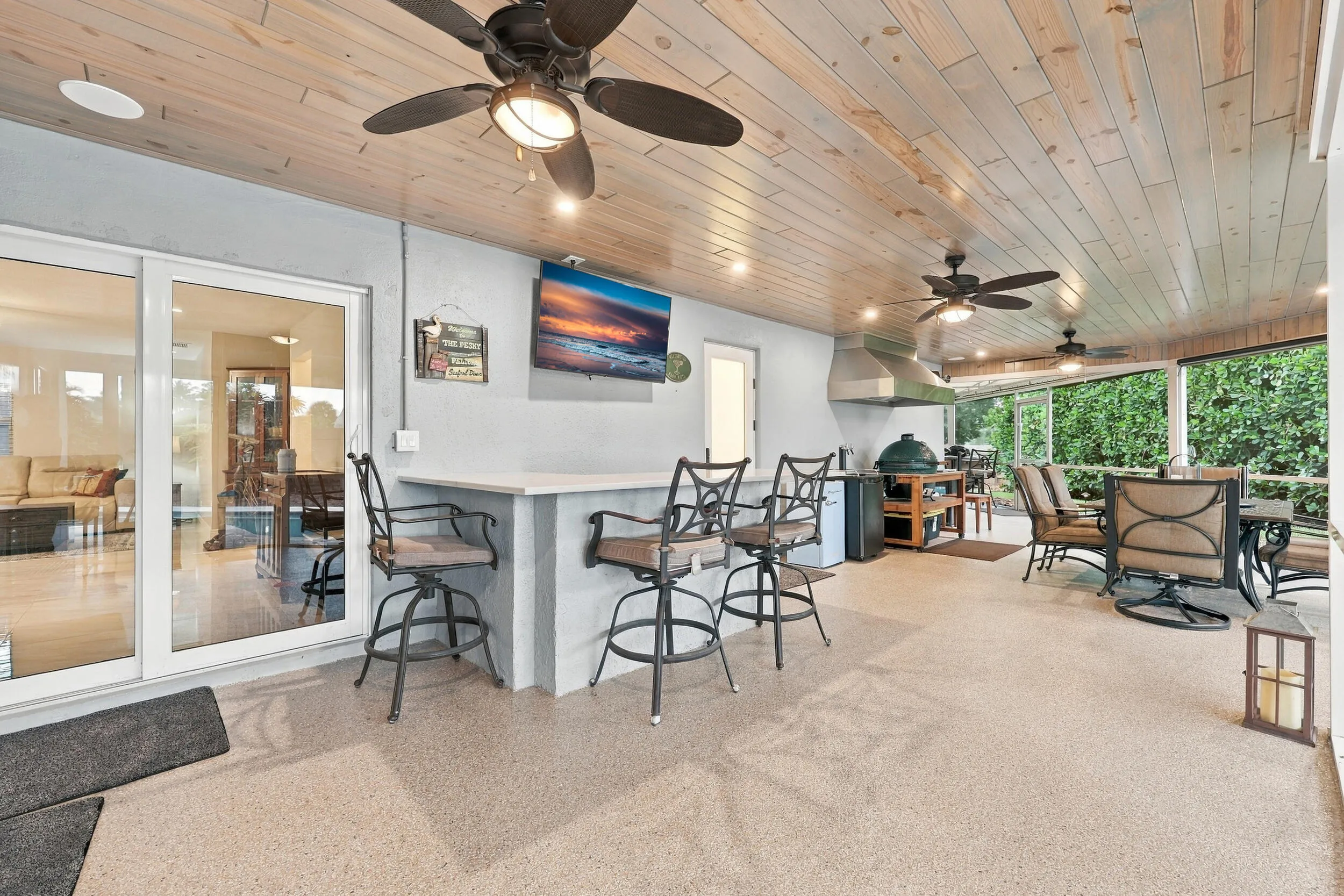 Live the epitome of the South Florida lifestyle with this 900 sq. ft. patio. It offers a built-in bar with quartz countertops, a built-in grill area with hooded exhaust, wood ceilings, recessed lights, tons of privacy and views of Lakeview Golf Course.