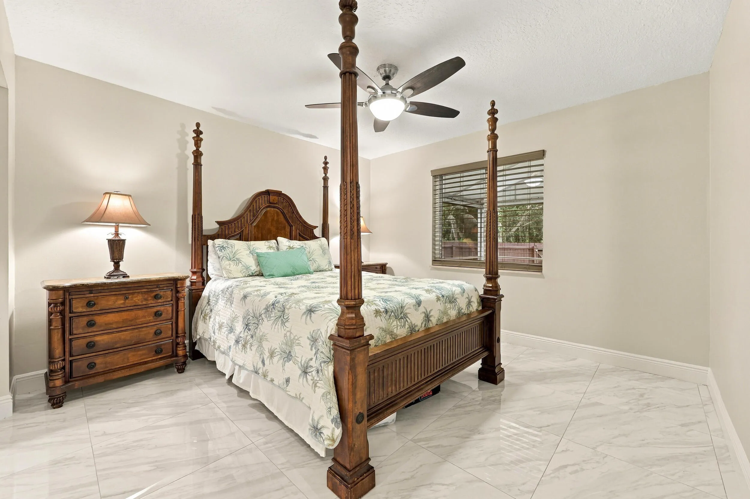 Guest bedroom 3 offers lots of natural light through a hurricane impact glass window and lots of closet space.