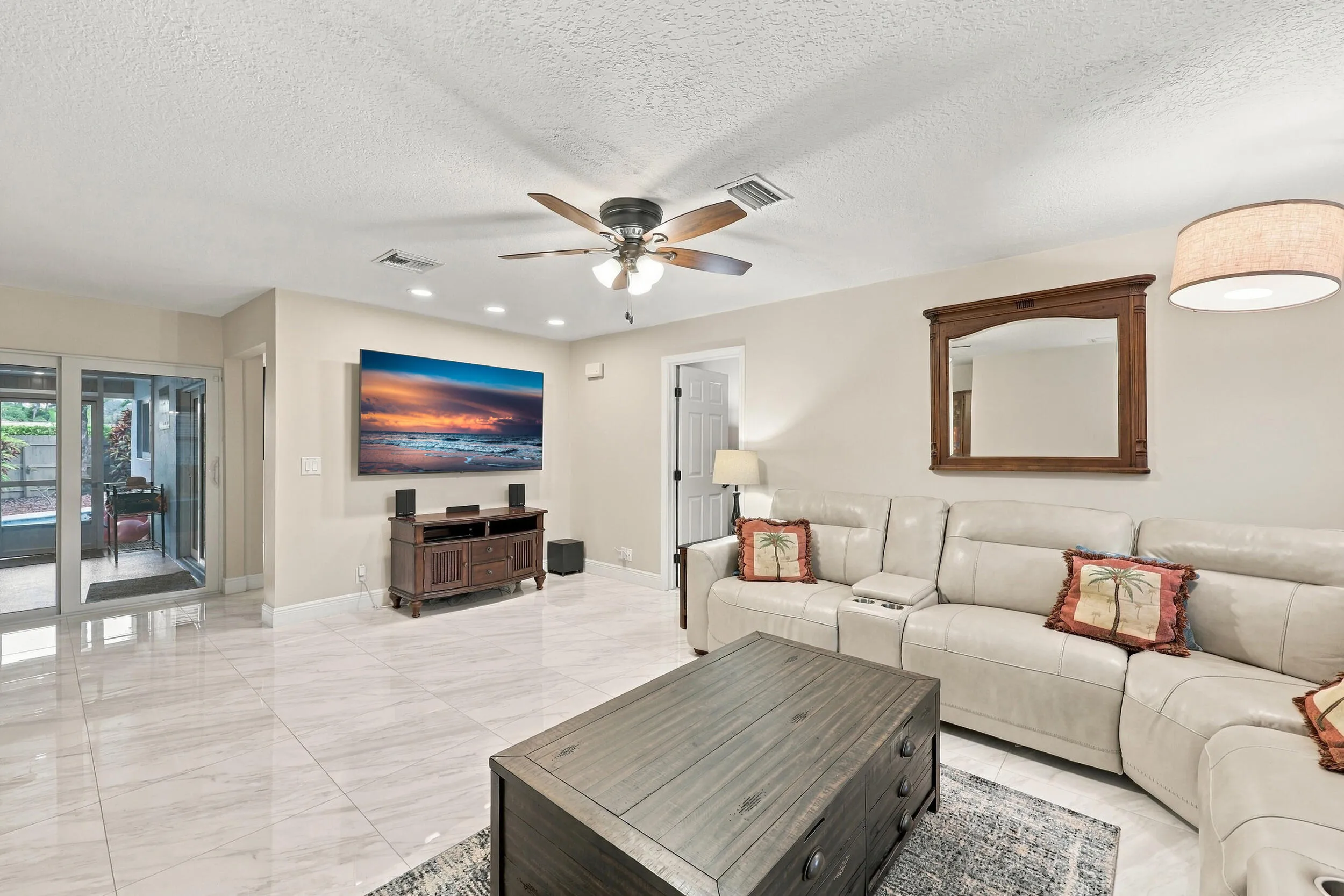 The family room is a versatile space for children of all ages. Relax and enjoy a separate area away from the kitchen and formal living room that also provides direct access through sliding glass doors to the covered patio and one-of-a-kind backyard.