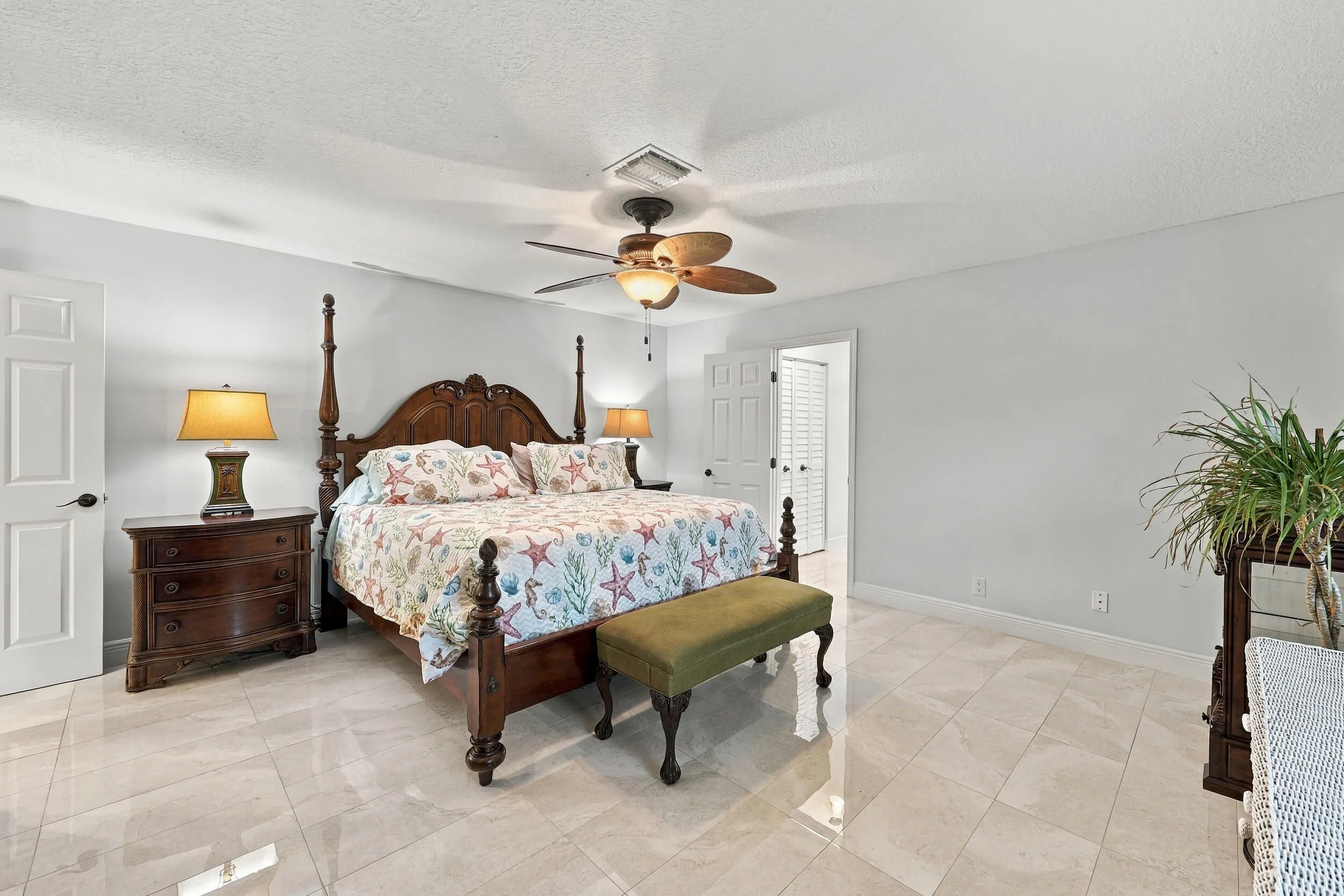 The primary suite has everything you have been looking for: spacious and elegant, with a walk-in closet, a fully updated en-suite bathroom, and lots of natural light.