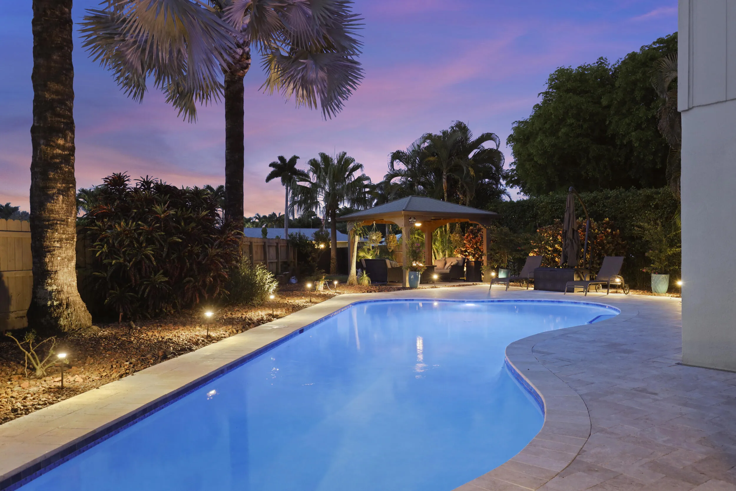 The resort-style pool starts underneath the roof line and expands down the oversized lot. Swim Olympic laps in your own backyard.