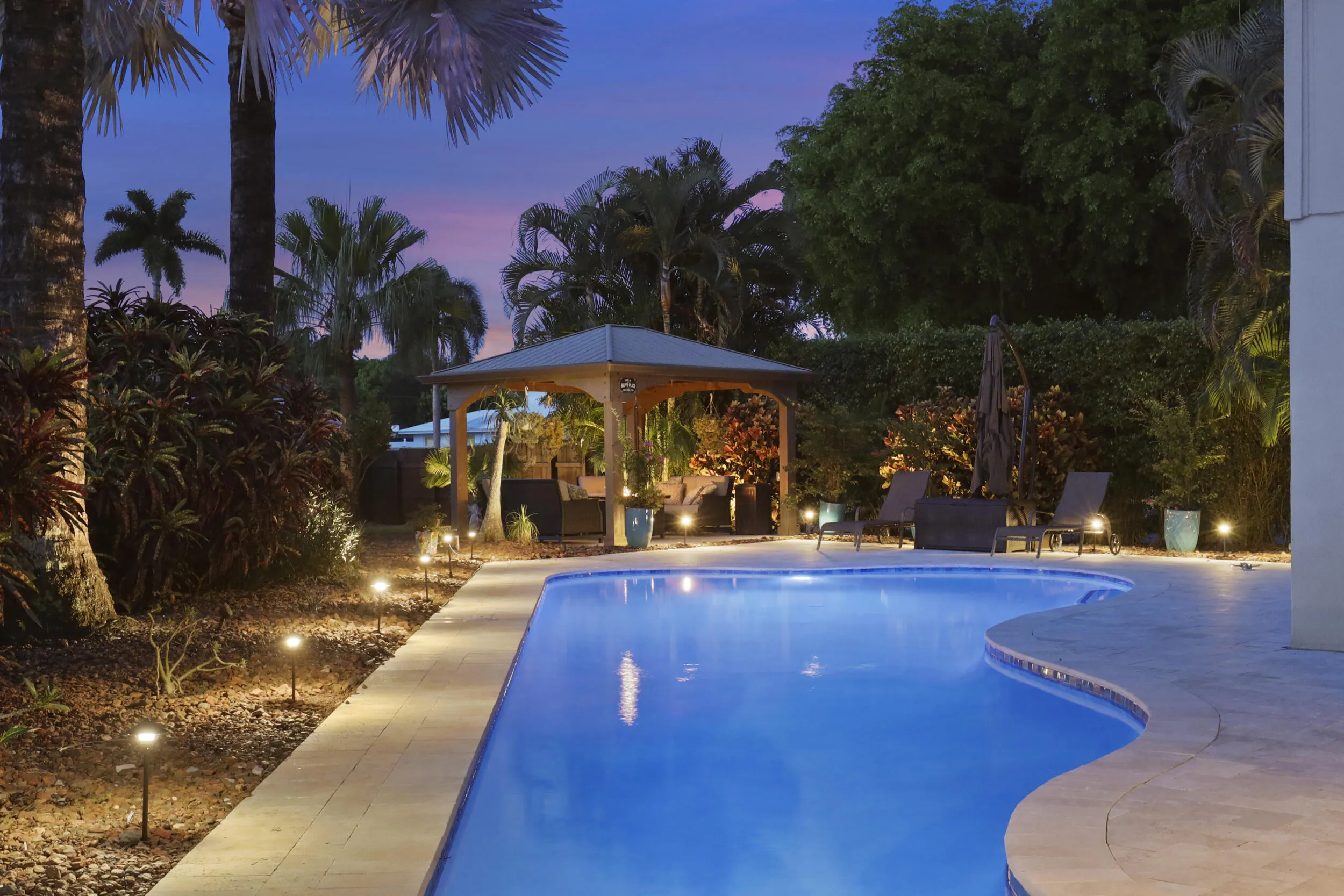 The resort-style pool starts underneath the roof line and expands down the oversized lot. Swim Olympic laps in your own backyard.